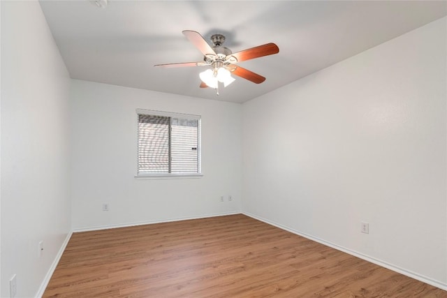 empty room featuring ceiling fan and light hardwood / wood-style floors