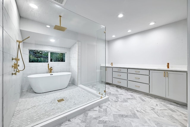 bathroom with vanity, separate shower and tub, and tile walls