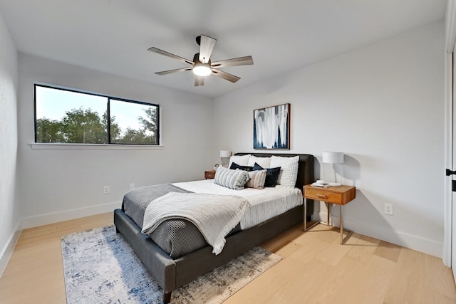 bedroom featuring ceiling fan and light wood-type flooring