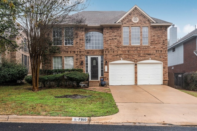 view of front of home featuring a garage and a front yard