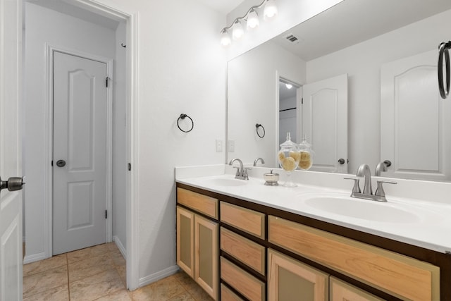 bathroom with vanity and tile patterned floors