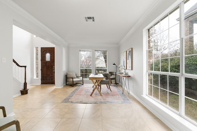 tiled entryway featuring ornamental molding