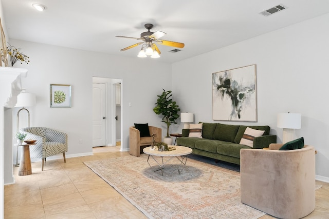 living room featuring ceiling fan and light tile patterned floors