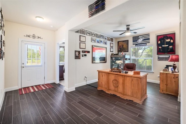 office area with ceiling fan and dark hardwood / wood-style flooring