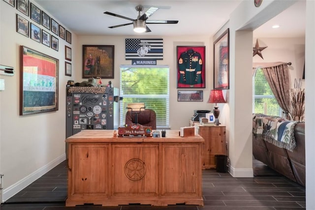 office with ceiling fan, wood finish floors, and baseboards