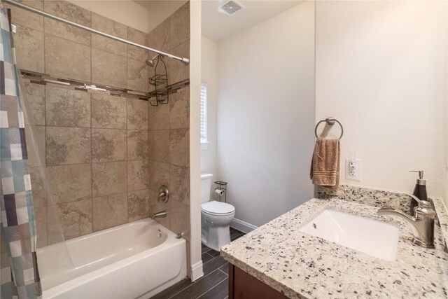 full bathroom featuring vanity, toilet, and shower / bath combo