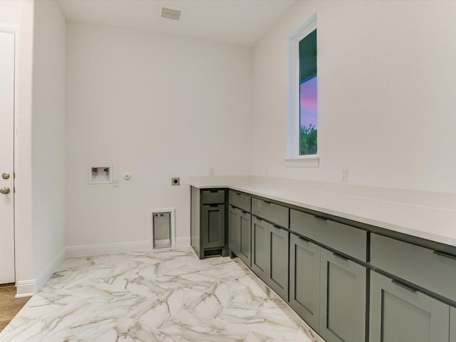 laundry room featuring cabinets, hookup for an electric dryer, hookup for a gas dryer, and hookup for a washing machine