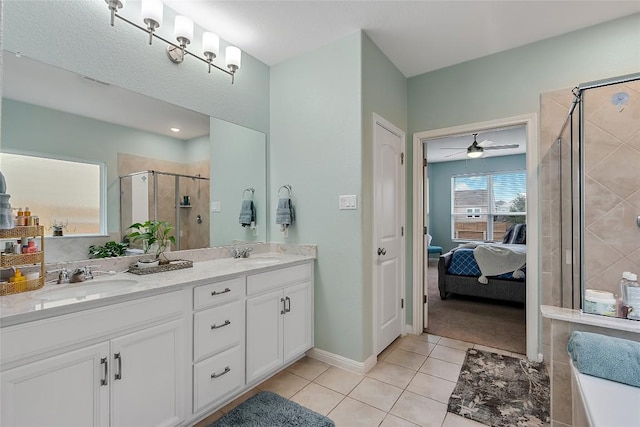 19405 Colgin Dr, Pflugerville, TX 78660 - full bath with tile patterned flooring, double vanity, a shower stall, ensuite bath, and ceiling fan