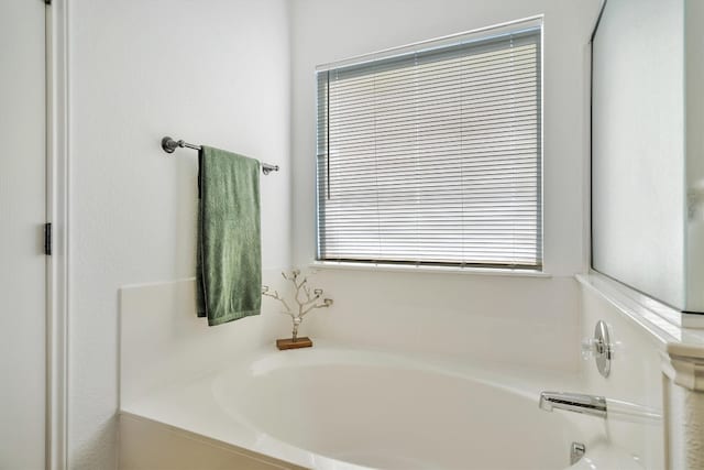 bathroom featuring a tub