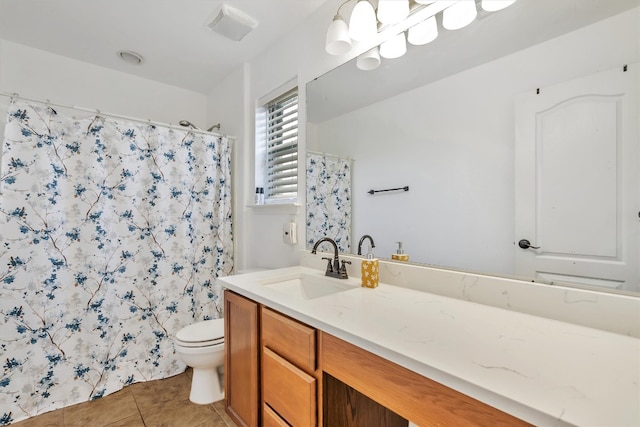 bathroom featuring vanity, tile patterned floors, toilet, and walk in shower