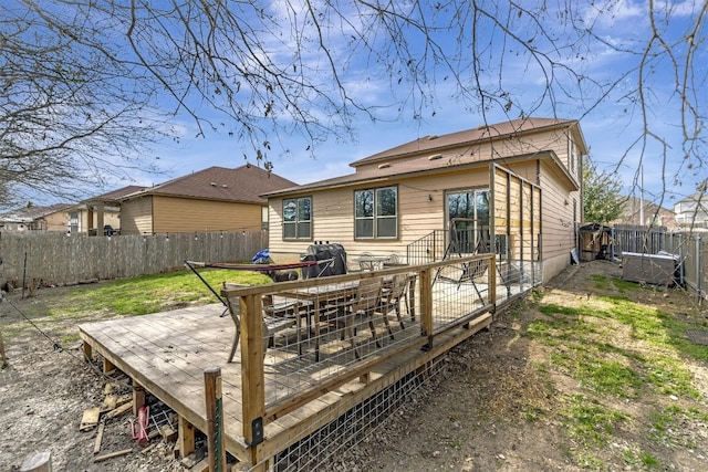 back of property with a wooden deck