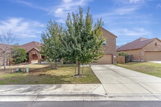 view of property hidden behind natural elements featuring a garage and a front lawn