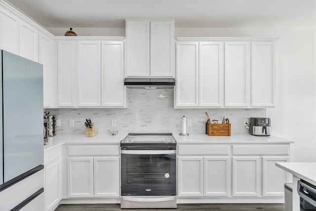 kitchen featuring white cabinetry, refrigerator, decorative backsplash, and electric range