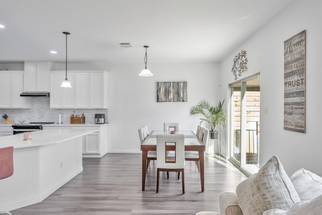 dining room with light wood-type flooring