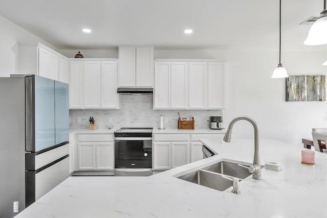 kitchen featuring stainless steel appliances, sink, and white cabinets