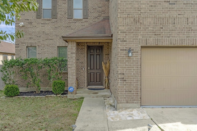 view of exterior entry featuring a garage