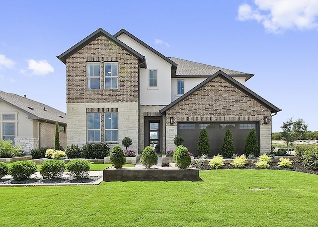 front of property with a garage and a front yard