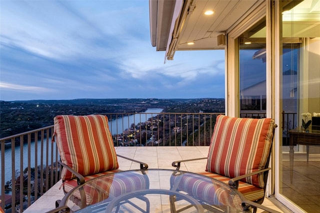 balcony featuring a water view