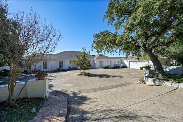 ranch-style house featuring a garage