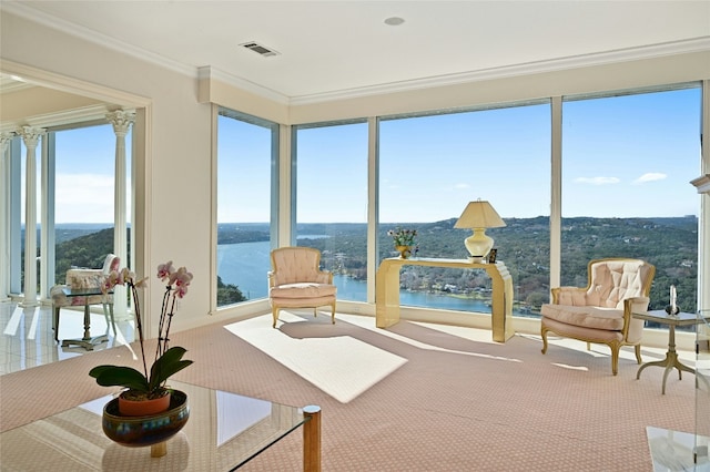 sunroom / solarium with a water view