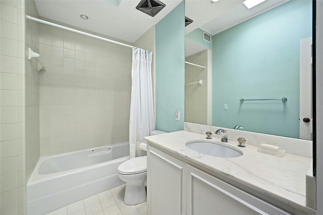 full bathroom with tile patterned flooring, vanity, toilet, and shower / bath combo with shower curtain