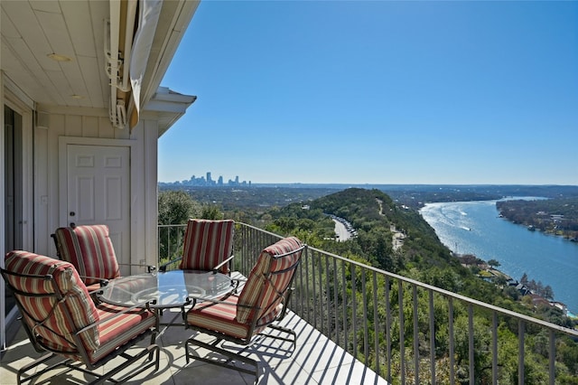 balcony featuring a water view