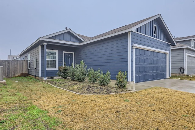 view of property exterior featuring cooling unit, a garage, and a lawn