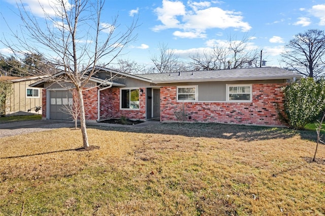 ranch-style home with a garage and a front lawn