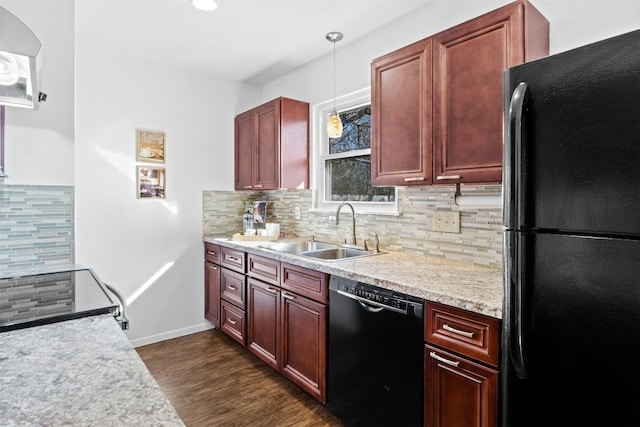 kitchen featuring sink, decorative light fixtures, dark wood-type flooring, black appliances, and decorative backsplash