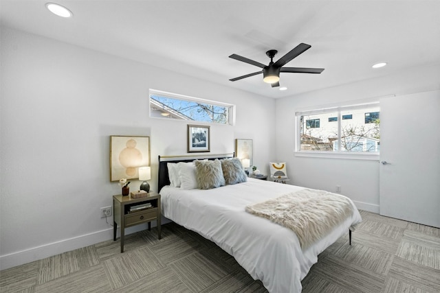 bedroom with recessed lighting, light colored carpet, and baseboards