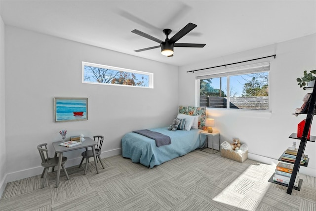 carpeted bedroom featuring ceiling fan