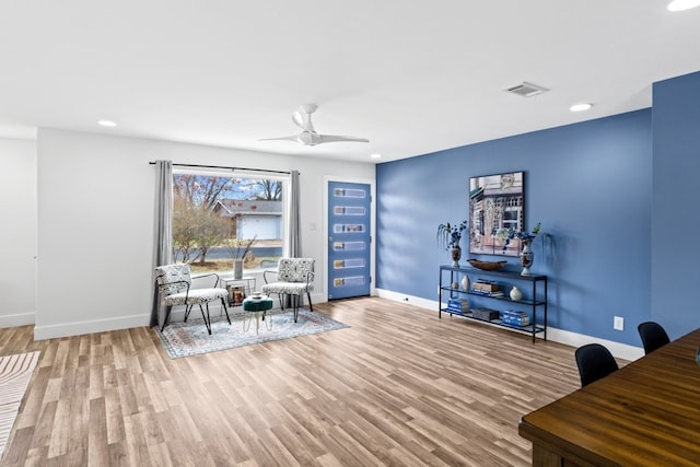 sitting room featuring ceiling fan and light hardwood / wood-style flooring