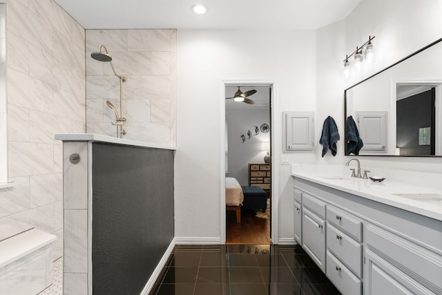 bathroom featuring vanity, tiled shower, and tile patterned floors