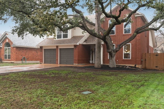 view of front facade featuring a garage and a front yard