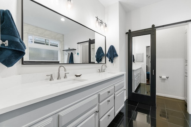 bathroom with vanity and tile patterned floors