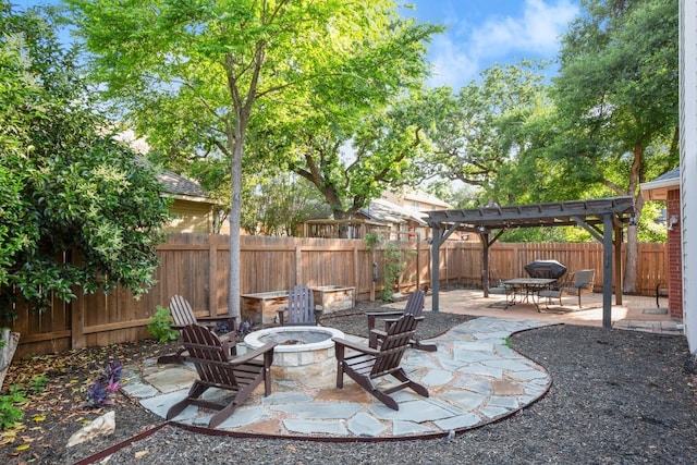 6136 Oliver Loving Trl, Austin, TX 78749 - fenced backyard featuring a fire pit, a pergola, and a patio
