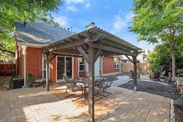 6136 Oliver Loving Trl, Austin, TX 78749 - view of patio featuring a fire pit and a pergola