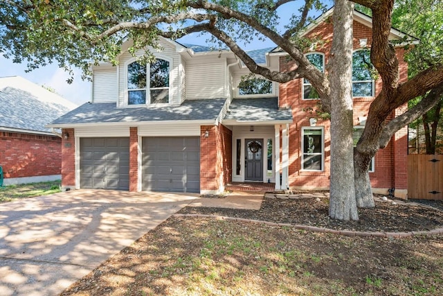 6136 Oliver Loving Trl, Austin, TX 78749 - traditional home with a garage, brick siding, driveway, and roof with shingles