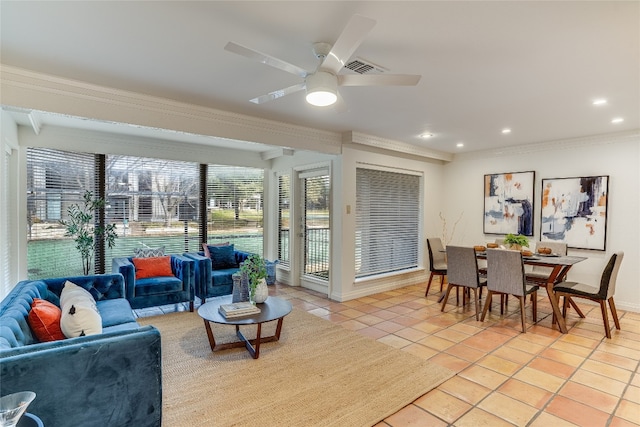 tiled living room featuring crown molding and ceiling fan