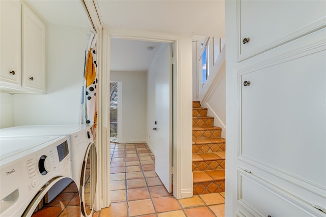 laundry room featuring light tile patterned floors and washer and clothes dryer