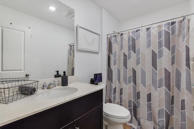 bathroom featuring vanity, a shower with curtain, and toilet