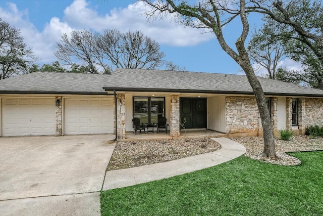 ranch-style house featuring a garage and a porch