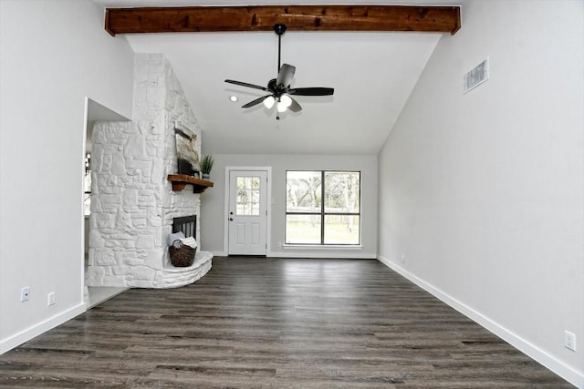 unfurnished living room featuring beamed ceiling, ceiling fan, dark wood-type flooring, and a fireplace