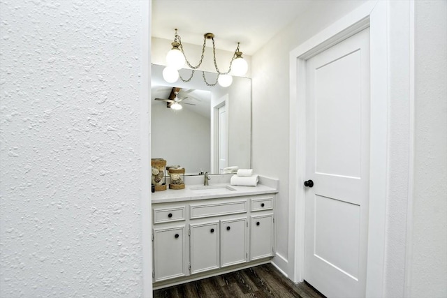 bathroom featuring vanity, wood-type flooring, and ceiling fan