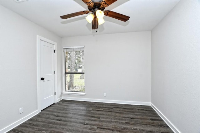 unfurnished room featuring dark wood-type flooring and ceiling fan