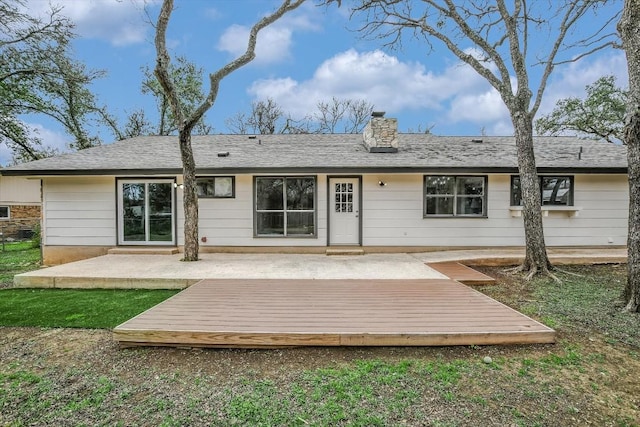 rear view of house with a deck