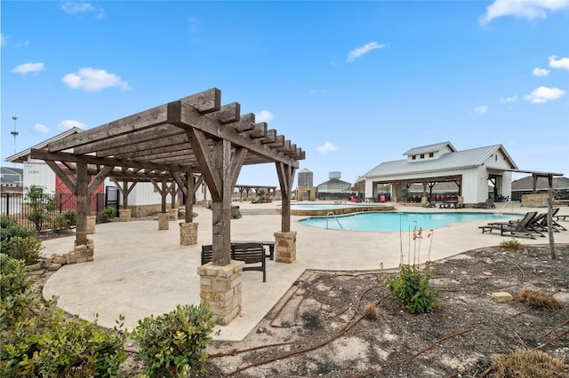 view of swimming pool featuring a patio area and a pergola