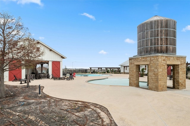 view of pool featuring a gazebo and a patio