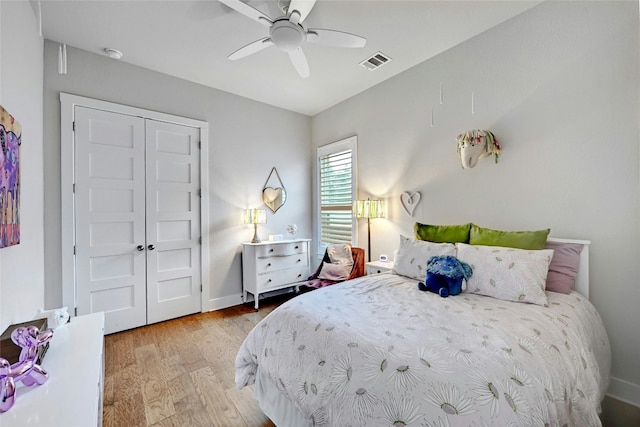 bedroom featuring ceiling fan and light hardwood / wood-style floors