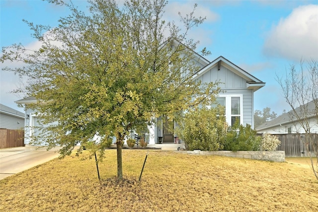 obstructed view of property featuring a front lawn